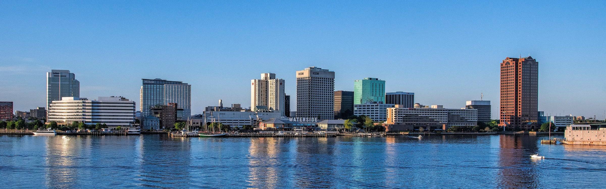The downtown Norfolk waterfront skyline seen across the water on a clear day